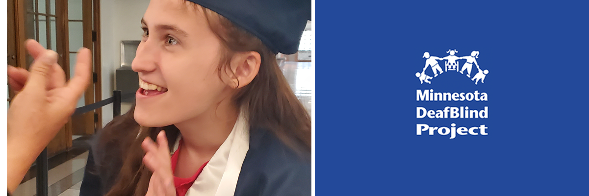 A teenage girl is wearing her graduation cap and gown and smiling at a person using ASL.