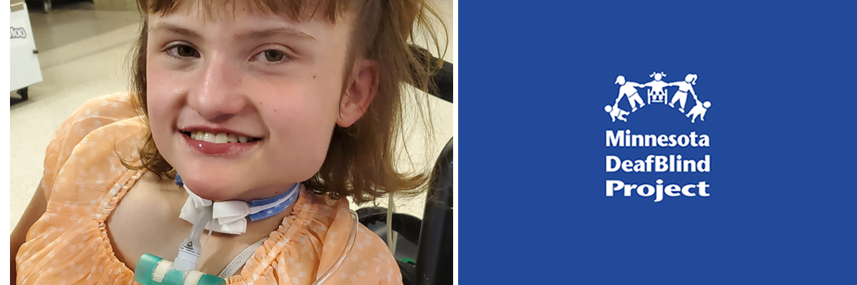 A white teenage girl with a trach is seated in her wheelchair and smiling at the camera).