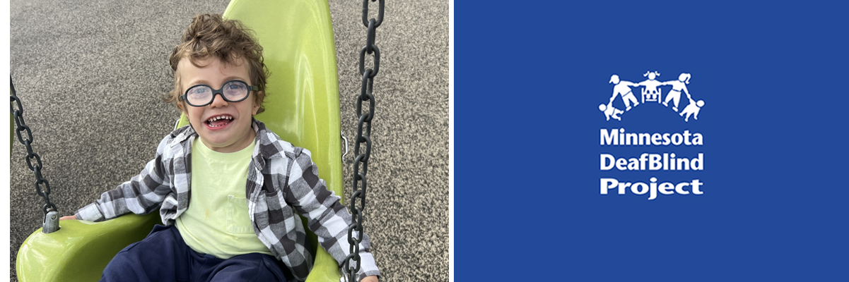 A young boy with light skin and light brown hair is wearing blue glasses and sitting in a yellow adapted swing with a big smile on his face.